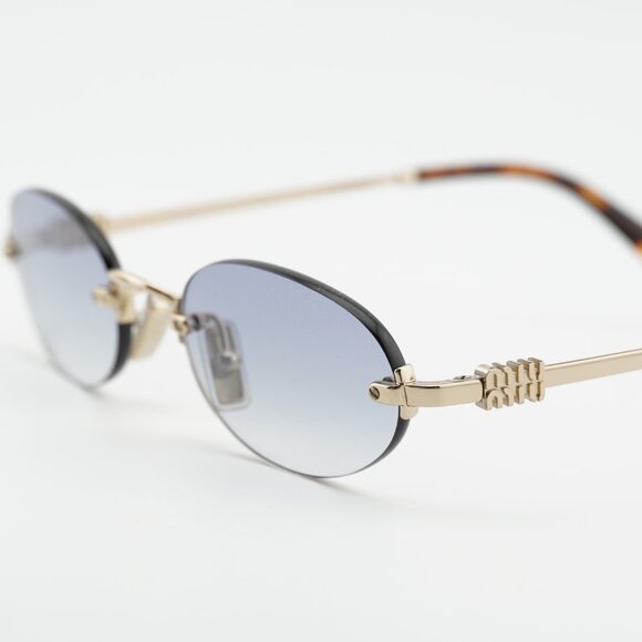 Miu Miu MUA54S ZVN80O Sunglasses Pale Gold Oval Frame main image 2